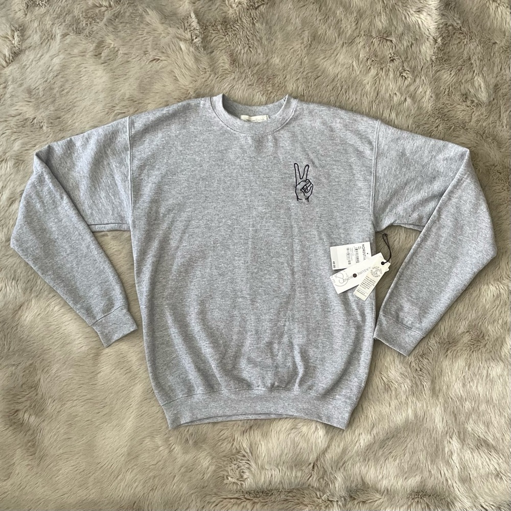 grey sweatshirt with a cute little peace sign